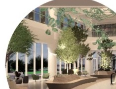 Rendered exterior courtyard view of the hospital atrium with landscaping and glazed facade.